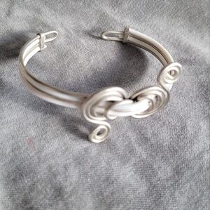 2/$12 Twisted silvertone wire and white vegan leather cuff bracelet